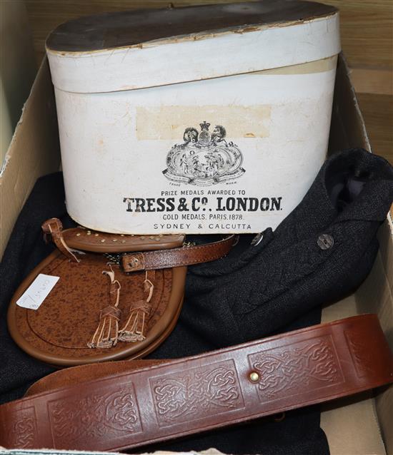 A boxed top hat, sporran, belt and jacket